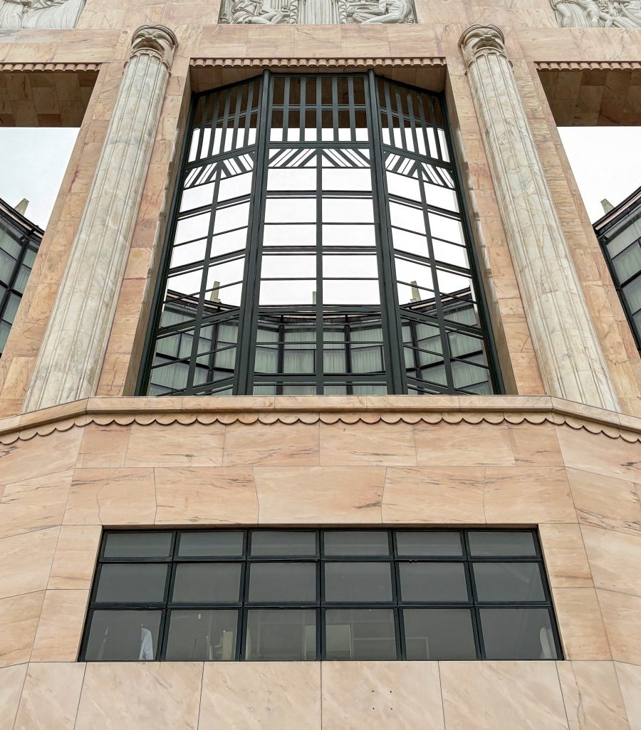 The Aurelia's restored Art Deco facade and marquee at dusk