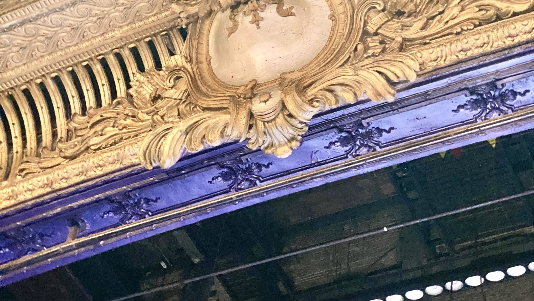 Ornate cinema auditorium ceiling and chandelier
