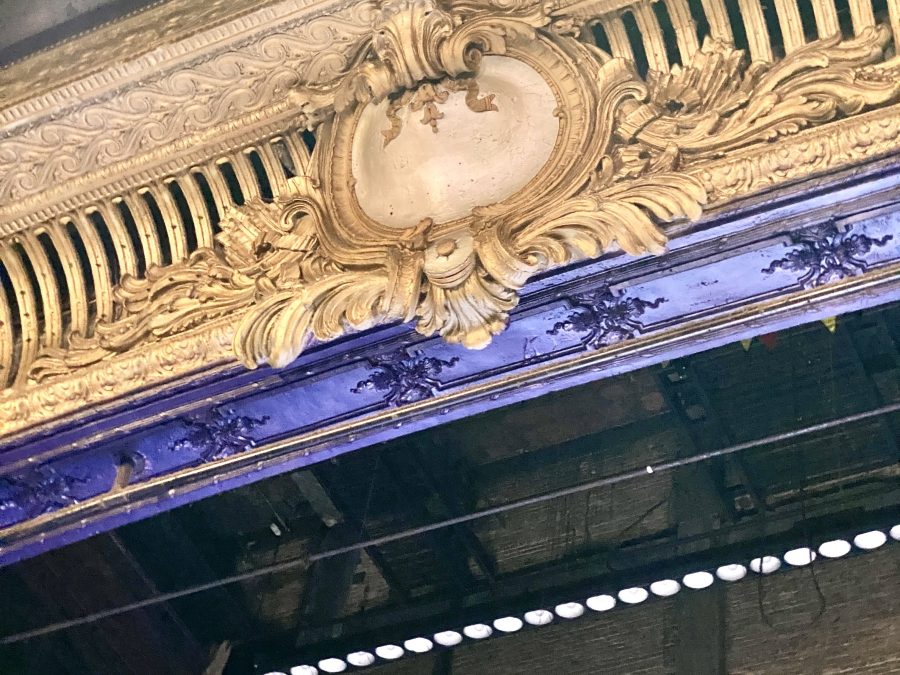 Ornate cinema auditorium ceiling and chandelier